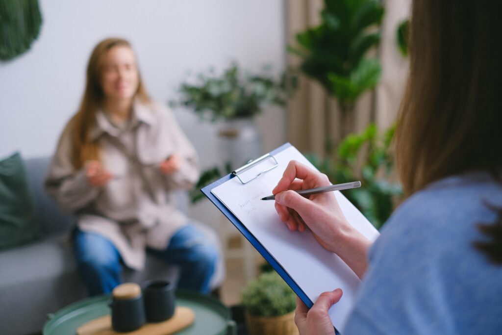 A person in therapy and receiving medication-assisted treatment (MAT).