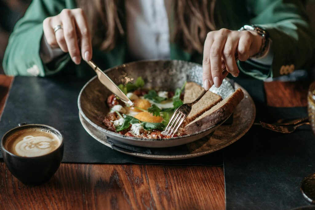 A person eating foods to improve mental health.